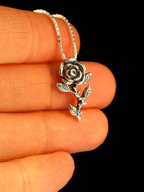 "Slow down and smell the Roses! This solid sterling silver rose charm is 13/16\"\" high and beautifully detailed. All Marty Magic Charms and Pendents include an 18 inch (46cm) box chain. If you would prefer a different length of chain please feel free to contact me. This item usually ships the same or next business day. All Marty Magic Jewelry is packaged in a beautiful purple box, embossed with the gold foil Marty Magic dragon logo. Perfect for any occasion! Designed in Santa Cruz California by Magic Charms, Rose Gold Initial, Unique Silver Rings, Womens Silver Jewelry, Pretty Jewelry Necklaces, Jewelry Flower, Jewelry Lockets, Rose Pendant, Unusual Jewelry