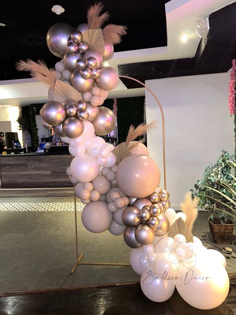 Balloon garland across round stand with pampas 🌾 Small Balloon Arch Backdrop, Outside Balloon Arch, Metal Arch Balloon Garland, Half Balloon Arch Backdrop, Metal Arch With Balloons, Balloon Arch And Pampas, Pampas Balloon Decor, Balloon Arch With Pampas, Balloons And Pampas