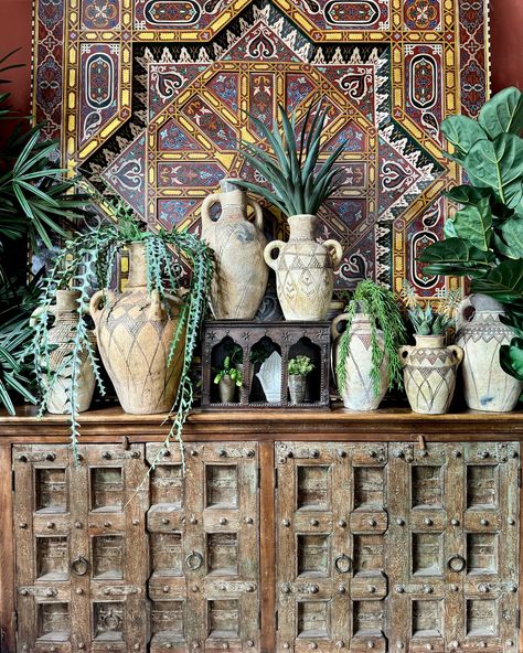 Berber pots and old Indian doors made into a stately buffet - a hand painted Moroccan ceiling panel as dramatic backdrop - it’s a beautiful, colorful world out here #tierradellagarto . . #welltraveledhome #maximalism #moreismore #moreismoredecor #rusticdecor #bohohome #eclecticdecor #colorfulhome #worldofinteriors #moroccanstyle #moroccandecor #indiandoors #olddoors Moroccan Buffet, Moroccan Ceiling, Ceiling Panel, Indian Doors, Colorful World, Ceiling Panels, Maximalism, Old Doors, Moroccan Decor