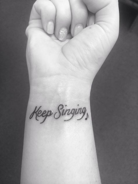 My Keep Singing wrist tattoo with a little music note next to it. Cute and girly and so meaningful! Music Words Tattoo, Sing Tattoo Music, Music Lyric Tattoos For Women, Meaningful Music Tattoos, Singing Tattoo Ideas, Singing Tattoo, Music Staff Tattoo, Girly Music, Music Graduation