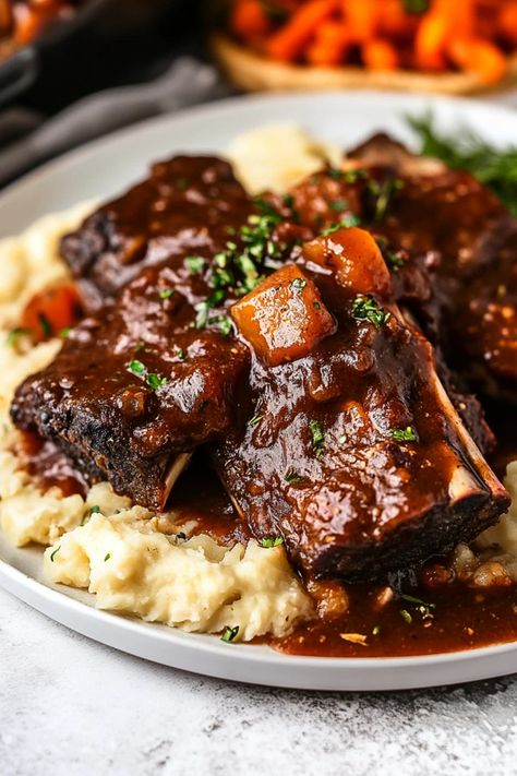 Tender, fall-off-the-bone short ribs simmered slowly for hours, infused with rich flavors of garlic, herbs, and a touch of red wine. Perfect for cozy dinners, this dish will make your home smell amazing as it cooks. Hungry? Click for the full recipe #SlowCookerRibs #ShortRibsRecipe #SlowCookerMeals #EasyDinnerIdeas #ComfortFood #BeefRecipes #FallRecipes #DinnerInspo #SlowCookerRecipes #CrockpotCooking #HeartyMeals #MealPrep #FamilyDinner #EasyCrockpotMeals Short Ribs Recipe Crockpot Bbq, Crockpot Meat Ideas, Crock Pot Boneless Short Ribs, Italian Short Ribs Slow Cooker, Crock Pot Short Ribs Recipe Crockpot, Slow Cooker Braised Short Ribs, Beef Shortribs Slowcooker, Slow Cooker Short Ribs Recipe Crock Pots, Crockpot Braised Short Ribs