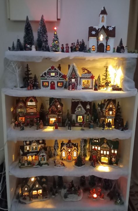 Christmas bookcase village Christmas Village Display On Shelves, Christmas Village Cabinet Display, Christmas Village Storage Ideas, Dept 56 Dickens Village Display Ideas, Christmas Village Table, Christmas Bookcase, Dickens Village Display, Miniature Christmas Village, Diy Christmas Village Displays