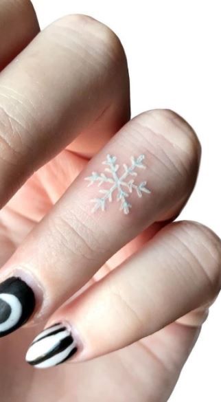 Different Color Tattoos Ink, White Tattoo Snowflake, White Ink Snowflake Tattoo, Snowflake Tattoo White, Snowflake Tattoo Behind Ear, Minimalist Tattoo White Ink, Mini White Tattoos, White Tattoo Finger, Snow Flake Tattoos For Women