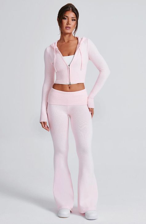 The Portia Knit Pants are a must-have for any wardrobe. These versatile pants feature a flattering fit and flare silhouette, with a wide rib waistband for added style. Complete the look with the matching Portia knit hoodie.     Colour: Pink.  Regular length.  Unlined.  Fit and flare silhouette.  Wide 2x2 rib waistband.  Fold over waistband detail.  Internal elastic in waistband.  Model is an XS and is wearing an XS.   Size: XS, S, M, L, XL, XXL Knit Pants Set, Light Pink Flare Leggings, Cute Sets Two Pieces, Matching Set Pants, Cute Lounge Wear, Knit Matching Set, Pink Matching Set, Pink Two Piece Set, Homecoming Dresses Corset