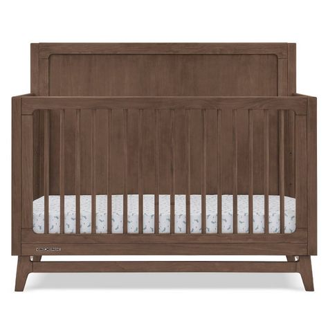 The mid-century design of the Spencer 6-in-1 Convertible Crib by Delta Children anchors nurseries with timeless style. You’ll love the solid headboard, round spindles and angled feet. Designed with everlasting style in mind, this versatile crib grows with your child, it features three mattress heights, and converts into a toddler bed, daybed, sofa and full size bed with and without footboard (Daybed/Sofa Rail included; Toddler Guardrail #W100725 and Full Size Wood Bed Rails #0050 sold separately Brown Crib White Dresser, Walnut Nursery Furniture, Brown Nursery Furniture, Brown Crib Nursery, Dark Wood Nursery, Headboard Round, Hippie Nursery, White Gate, Navy Nursery Boy