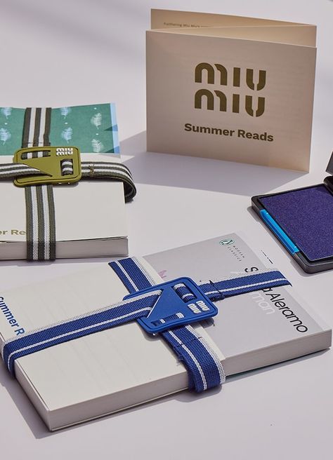 Miu Miu Summer Reads | Miu Miu Miu Miu Packaging, Miu Miu Summer, Coffee Bakery, Paris Seine, Paper Carrier Bags, Summer Reads, Wallet Pouch, Beach Wear Dresses, Leather Shirt