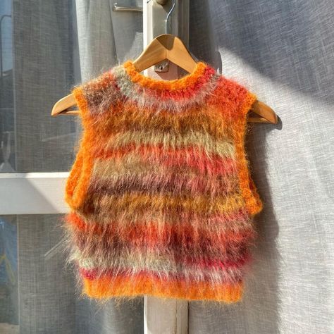 Fuzzy vest made with mohair and silk yarn is now available for purchasing! 🧶 This piece was freehanded by me using 80% mohair and 20% silk … | Instagram Mohair Free Pattern, Mohair Sweater Vest, Fuzzy Yarn Projects, Mohair Granny Square, Fuzzy Crochet Projects, Stripy Jumpers, Crochet Mohair Sweater, Mohair Top, Mohair Crochet