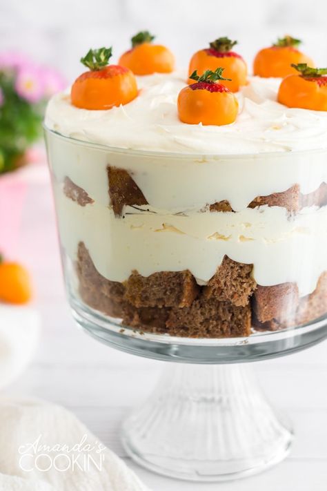 This carrot cake trifle has layers of moist carrot cake and no-bake cheesecake filling then topped with adorable strawberry "carrots". #carrotcake #easter #easterdessert #easterrecipes #dessert #trifle #cake Easter Trifle Desserts, Carrot Cake Trifle, Easter Trifle, Strawberry Carrots, Trifle Bowl Recipes, Cake Trifle, Trifle Dessert Recipes, Pineapple Dream Dessert, No Bake Cheesecake Filling