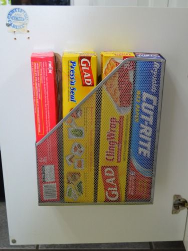 Get plastic wrap and aluminum foil out of the way by stowing them in a well-hidden magazine file. Small Kitchen Cabinet Storage, Small Kitchen Storage, Storage Hacks, Tiny Kitchen, Door Storage, Cabinet Door, Small Apartments, Organization Hacks, A Kitchen