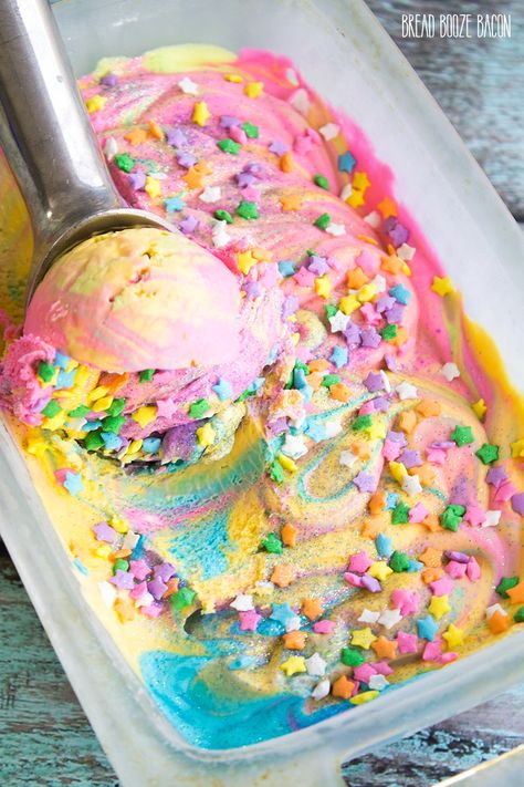 Unicorn Ice Cream is magic on a cone! There's nothing better on a hot day than rainbow ice cream that's covered in star sprinkles and glitter! Bread Booze Bacon, Unicorn Ice Cream, Pastel Cupcakes, Rainbow Ice Cream, Star Sprinkles, Rainbow Food, Ice Cream Popsicles, Crazy Cakes, Homemade Ice