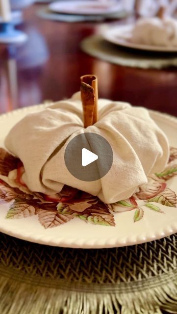 Robyn Davis on Instagram: "Let’s make some pumpkin napkins! 
A simple round napkin ring of any kind will work. All you do is pull the middle of the napkin through a little and then tuck each corner inside the ring. Repeat this twice. Flip it over and bunch together to make it fluff. Then stick a cinnamon stick in the middle for its stem. 

#pumpkinnapkins #pumpkins #placesetting #tablescape #falltable #falltableideas #hometips #hosting #falltableideas #autumnvibes #tablescapetuesday #napkinfolding" Pumpkin Folding Napkins, Diy Thanksgiving Napkin Rings, Diy Napkin Rings Thanksgiving, Pumpkin Napkins, Thanksgiving Napkin Rings, Fall Napkins, Napkin Rings Diy, Thanksgiving Diy, Stuck In The Middle