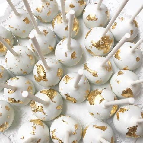 Obsessed with these 24k edible gold leaf cake pops for an intimate wedding✨ . . . #carlipenelopeevents #cakepops #customdesserts #dessert #eventplanner #njwedding #bride #bridetobe #njbaker #wedding #theknot #goldleaf #24kgold #oreotruffle #desserttable #eventstylist Wedding Cake And Cake Pops, Gold Cake Pops, White And Gold Cake Pops, Gold Cake Pops Ideas, Pink Gold Cake Pops, White And Gold Cakepops, Neutral Color Cake Pops, Pink White And Gold Cake Pops, Yellow Cake Pops