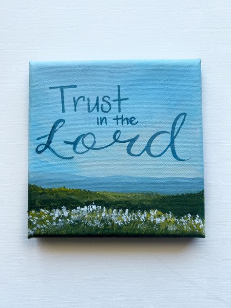 Welcome to Kainoa's Artistry! Embrace serenity and faith with my latest hand-painted acrylic painting of a quiet landscape, featuring the inspiring scripture "Trust in The Lord" from Proverbs 3:5 (ESV). This beautiful artwork, created on a 5x5 inch stretched canvas, is perfect for adding a touch of peacefulness and spiritual encouragement to any space. Ideal as a thoughtful gift or a meaningful addition to your home or office décor, this painting combines natural beauty with a powerful message o Paintings About Hope, Canvas Art Collage Wall, Cute Paint Ideas On Canvas, Canvas Christian Painting, Easy Inspirational Paintings, Worship Painting Ideas, Lds Paintings Easy, Paintings To Give As Gifts, Painting Ideas On Canvas Meaningful