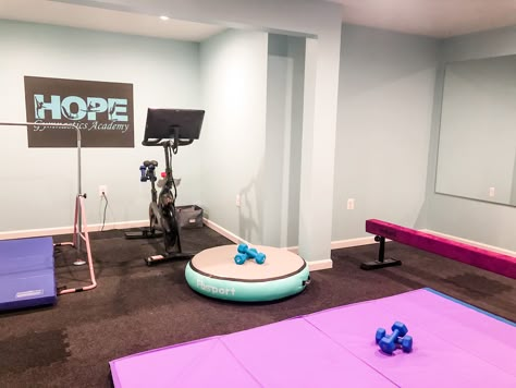 Turn a dark basement room into a cheery home gym that works for youth gymnastics practice or an adult home workout Home Gymnastics Gym, Garage Gymnastics Gym, Basement Gymnastics Area, Gymnastics Home Gym, Home Gymnastics Room For Kids, Gymnastics Room In House, At Home Gymnastics Room, Home Gymnastics Room, Gymnastics Room Ideas