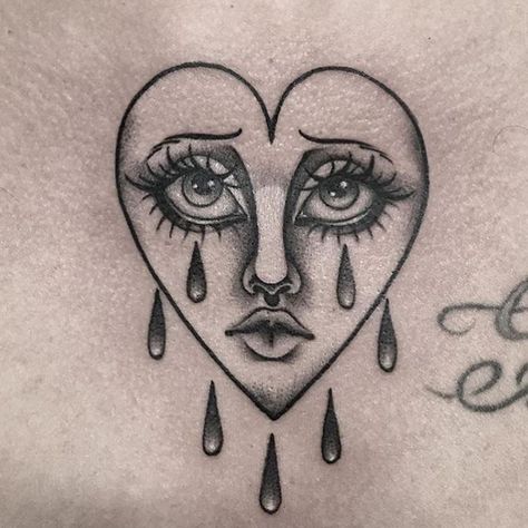 Face In Heart Tattoo, Small Heart Face Tattoo, Heart With Tears Tattoo, Love Heart Face Tattoo, Heart Tattoo On Face, Crying Heart Old School, Tattoo On Face, Black Heart Tattoo, Crying Heart