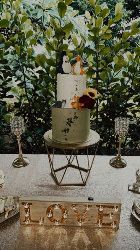 Green and white Wedding cake with a Pokémon cake Topper (Snorlax and Dragonite). You can see leaves and greens in the background and a Love sign at the front Wedding Pokemon, Pokemon Wedding Ideas, Pokemon Wedding Cake, Nerd Wedding Cake, Pokemon Wedding, Groomsman Cake, 2023 Bride, Nerd Wedding, Pokemon Snorlax