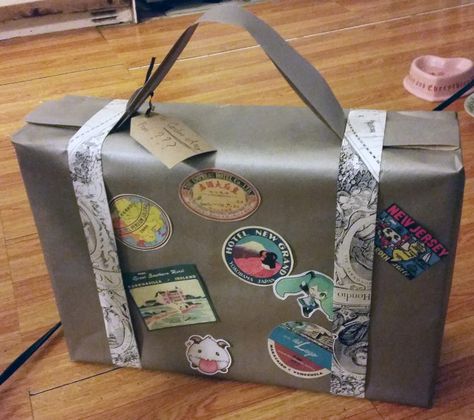 Luggage Gift Wrapping Ideas, Travel Gift Wrapping Ideas, Suitcase Gift Wrapping, How To Wrap Luggage As A Gift, How To Wrap A Surprise Trip Gift Ideas, Functional Bags With Luggage Sleeve As Gift, Travel Theme Bridal Shower, Luggage Handle Wrap, Black Wrapping Paper