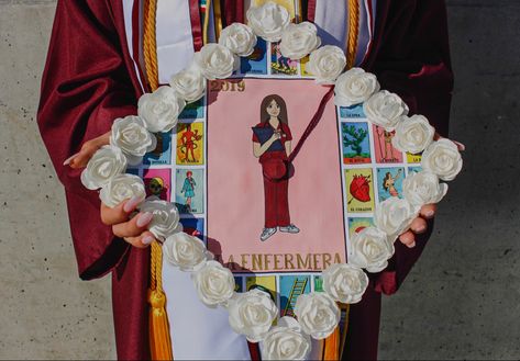 Custom grad cap with loteria “La Enfermera” card painted with acrylic and paper flowers Grad Cap Design, Grad Caps, Grad Cap, Cap Design, Paper Flowers, Flowers