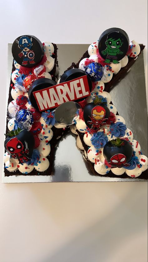 Marvel letter cake Superhero Number Cake, K Birthday Cake Letter, Marvel Number Cake, Spiderman Number Cake, Number 5 Superhero Cake, Marvel First Birthday Cake, Avengers Themed Cakes, Marvel Avengers Cake, Superman Cakes