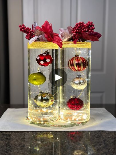 2K views · 40 reactions | Super easy Christmas decoration | Super easy Christmas decoration I took a few Christmas ornaments from my tree and added them to a vase full of Orbeez to make a beautiful decoration. | By Cirqnamics | Okay, I have two vases here filled up to about a quarter. Now, I have my ornaments and I'm going to submerge them just under the beads but not touching the floor or the bottom of the vase I guess you can say to kind of give that floating effect. So, submerge to that and add more beads. I also have some coiled lights on the bottom there because I love the way that lights look underwater. Very magical, very magic of Christmas. Okay, we're going to top those Alright, I'm going to submerge that one there too. It doesn't have to be one right on top of the other. I kind Christmas Vases, Gel Beads, Easy Christmas Decorations, Water Beads, Magic Of Christmas, Beautiful Decoration, Easy Christmas, Simple Christmas, Christmas Magic