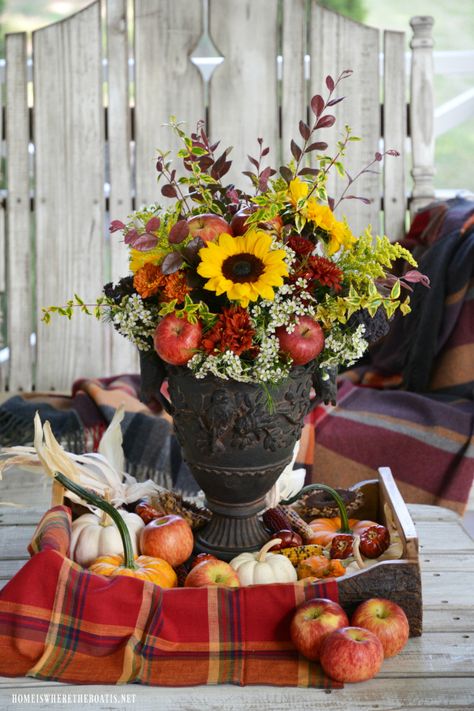 Fall arrangement with apples, mums and sunflowers | ©homeiswheretheboatis.net #fall #flowers #sunflowers #apples #FloralFriday Fall Apple Centerpieces, Apples And Sunflowers Decor, Apple And Sunflower Decor, Late Summer Decor, Sunflower Tablescapes, Gratitude Gathering, Grandpas Birthday, Fall Flower Pots, Apple Centerpieces