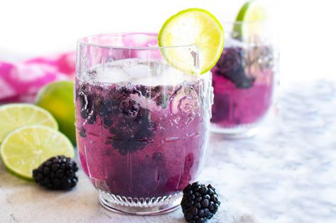 Fresh blackberries, lime juice, club soda, and tequila -- this blackberry spritzer is the perfect cocktail pick, add lime slices and a lemon twist for fun. Low Carb Liquor, Bird Dog Whiskey, Blackberry Whiskey, Blackberry Mojito, Thyme Simple Syrup, Blackberry Gin, Classic Gin Cocktails, Limeade Recipe, Spritzer Recipes