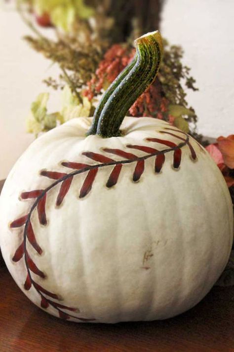 This cool and creative pumpkin is a guaranteed home run.  Get the tutorial at Life in Left Field.   What you'll need: White  Funkin ($40; amazon.com), White paint ($5; amazon.com), Black paint ($6; amazon.com), Burnt umber paint ($7; amazon.com), Red paint ($3; amazon.com) Baseball Pumpkin, Cool Pumpkin Designs, Nella The Princess Knight, Pumkin Decoration, Pumpkin Contest, Hallowen Ideas, Creative Pumpkins, Fall Decoration, Theme Halloween