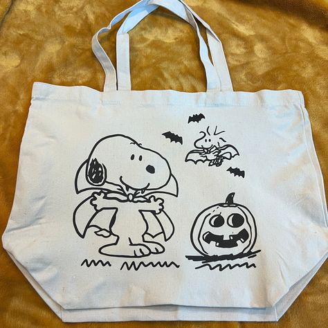 "Spooky Snoopy Halloween! This is a 19.7\"x15.7\"x7.9\" cotton canvas tote bag. This is made with HTV and a heat press. Hand wash gently inside out with cold water or spot clean. Lay flat to dry. Do not iron on the image. I make these all by hand to order so please expect a little variety in each tote :)" Spooky Snoopy, Snoopy Bag, Fall Tote Bag, Snoopy Halloween, Snoopy Wallpaper, Halloween Tote Bag, Halloween Tote, Snoopy Love, Fall Halloween Decor