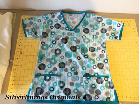 Scrub top I made with fabric from Joann Fabric.  silverliningsoriginals.blogspot.com Diy Scrub Top, Scrub Tops Pattern, Scrubs Uniform Pattern, Scrub Suit Design, Nursing Scrubs Pattern, Top Pattern Sewing, Scrubs Pattern, Crochet Scrubbies, Teal And Gray