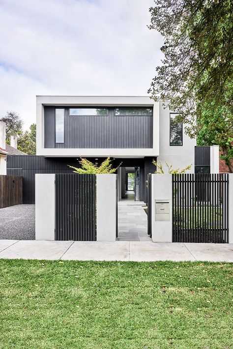 The modern appeal of symmetry and light in this modern façade maximises its aspect and illuminates the home from within. Architectural Facade, Aerated Concrete, Concrete Fence, Front Fence, Front Gates, Australian Architecture, Modern Fence, Timber Cladding, Custom Built Homes