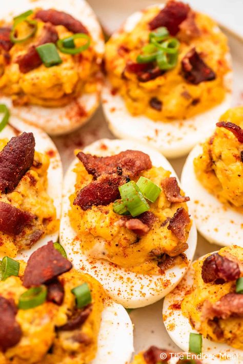 PIN TO SAVE FOR LATER! Deviled Eggs with Bacon are the ultimate deviled eggs. We add some caramelized onions and a little cheddar cheese to totally take these over the top. It's an appetizer recipe that gets rave reviews every time it is served. #theendlessmeal #eggs #deviledeggs #devilledeggs #bacon #baconeggs #bacondeviledeggs #easter #appetizer #appetizerrecipes #easterrecipes #partyrecipes #eggrecipes Bacon Deviled Eggs Recipe, Deep Fried Deviled Eggs, Deviled Eggs With Bacon, Easter Appetizer, Easy Bacon Recipes, Canned Bacon, Eggs With Bacon, Thanksgiving Deviled Eggs, Fried Deviled Eggs