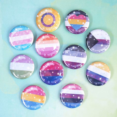 Dreamy Pride Pins! Tell them who you are with these pretty pride flag pins featuring a starry illustration and subtle texture by our talented artist Schlady! Choose from: Asexual, Nonbinary, Lesbian, Genderfluid, Trans, Genderqueer, Pansexual, Panaromantic, Intersex, Demi. About these pins: Size: 1.25" Traditional metal pinback button One per order Starry Illustration, Pride Buttons, Lgbtq Icons, Lgbt Flags, Pride Pins, Lgbtq Stuff, Pan Pride, Pride Shoes, Pride Jewellery