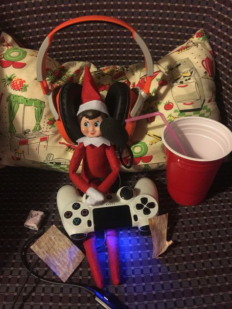 Elf on the shelf playing video games with drink and snacks Elf On The Shelf Computer Ideas, Elf On The Shelf Video Game Ideas, Elf On The Shelf Football Ideas, Elf Playing Video Games, Elf On The Shelf Watching Tv, Elf On The Shelf Pee Or Apple Juice, Elf On The Shelf Video Games, Elf Gif, Elves At Play