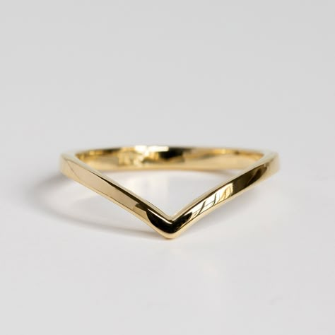 "This is a dainty 14K/18K curved gold wedding ring, a perfect V shape solid gold stacking ring, a beautiful choice for a chevron wedding ring, bridal nesting ring. Elegant and simple Chevron ring in 14K/18K solid gold. This ring is designed for those who love simplicity and minimalism. It can be beautifully stacked with your other rings. Materials & Measurements: ✤ 14K OR 18K yellow/rose/white gold. Please select your favorite color from the drop-down menu, when ordering. ✤ Bandwidth on the Gold V Ring, Modern Gold Curved Rings, V Shaped Gold Wedding Band, Elegant 14k Gold Curved Rings, Chevron Wedding Ring, Gold Chevron Ring, Contour Wedding Band, Chevron Wedding, Gold Rings Fashion