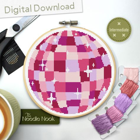 This adorable disco ball will bring a pop of pink magic to your walls! Instant PDF Download Only! No physical product will be sent to you, instead enjoy the convenience of a digital download, allowing you to access the pattern instantly and begin stitching right away. Please read the description before purchasing! Key Pattern Information: - 100 x 100 Stitches - 7 DMC Colours - Skill Level: Intermediate Finished Sizes: - 14ct Aida = 7.1 x 7.1" (18.0 x 18.0cm)  - 16ct Aida = 6.3 x 6.3" (16.0 x 16. Disco Ball Cross Stitch Pattern, Free Cross Stitch Patterns To Download, Cross Stitch Gifts, Diy Y2k, Pink Cross Stitch, Craft Wall Decor, Pink Disco Ball, Pink Diy, Pink Magic