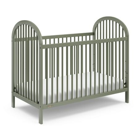 Introducing the Graco Olivia 3-in-1 Convertible Crib. With its clean lines, stylish curves, rounded details, and easy-to-match, arched design, the Olivia is the perfect addition to any nursery no matter your style. The Olivia is crafted from pine wood, and its applied finish has been tested to meet or exceed the applicable ASTM and CPSIA safety standards. The Olivia is JPMA Certified meaning it's been expertly tested by third-party, accredited laboratories to meet or exceed all of the applicable Green Baby Nursery, Green Crib, Gender Neutral Baby Nursery, Baby Cribs Convertible, Arched Design, Baby Crib Mattress, Best Crib, Dream Nurseries, Toddler Mattress