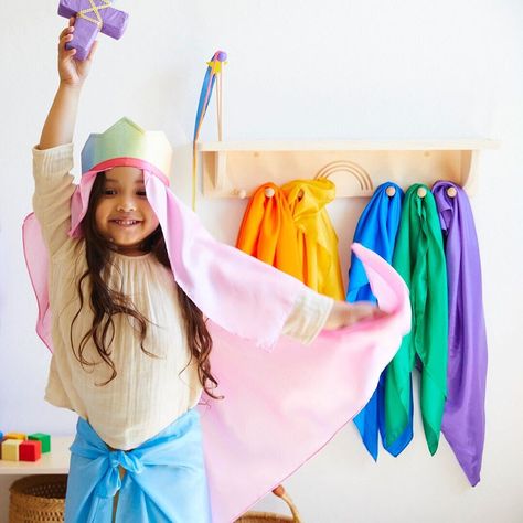 Our NEW Wooden Dress-up Display! The perfect addition to your playroom and invites hours of open-ended play!🌈 ⭐ 6 pegs to hold your dress-ups ⭐ 1 slot to fit your soft silk sword ⭐ 3 holes to display your streamers #sarahssilks #dressup #playsilks #playroom #openendedplay Wooden Dress, Encaustic Wax Art, Wax Art, Christmas World, The Gruffalo, Track Toy, Traditional Toys, Play Furniture, Open Ended Play