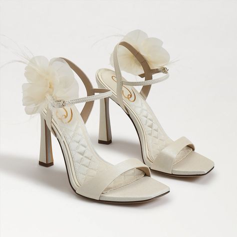 Chic Ivory Sandals With A Stylish Floral Detail. Sensual And Strappy, The Leana Sandal Is Polished To Perfection With A Super Sweet Corsage Detail And Structural Wooden Stacked Heel. Wear To Take Center Stage. Heel Height: 4 Inches Closure: Buckle Material: Fabric Insole: Fabric Perfect For Weddings Or Special Occasions. Features A Comfortable Heel And Elegant Design.