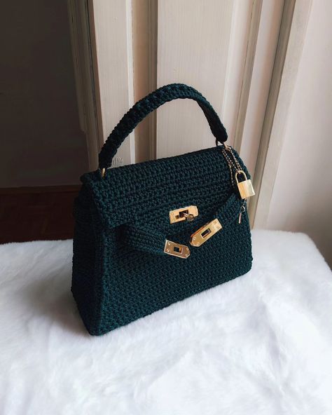 Introducing our stunning handcrafted crochet bag in vibrant emerald green! 👜 Featuring a popular bag opening mechanism, this design combines elegance and functionality, ensuring easy access while keeping your belongings secure. 🔐 With internal reinforcement for a structured shape and a luxurious satin lining, this trapezoid bag is perfect for both special occasions and everyday outings. The golden hardware adds a touch of sophistication to the overall design.🦪♥️ Available in various colors ... Popular Bags, Overall Design, Crochet Bag, Emerald Green, Easy Access, Emerald, Special Occasion, Satin, Crochet