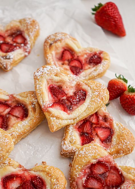 These sweet, heart shaped strawberry cream cheese Danishes are as cute as can be and make a special treat for loved ones! Each heart has a light smooth cream cheese filling with bursts of fruity strawberry jam and fresh strawberries; sitting atop a flaky, buttery pastry. Cream Cheese Danishes, Heart Shaped Strawberry, Valentine's Desserts, Cream Cheese Danish Recipe, Cheese Danishes, Cream Cheese Puff Pastry, Cheese Danish Recipe, Cream Cheese Pastry, Pie And Tart