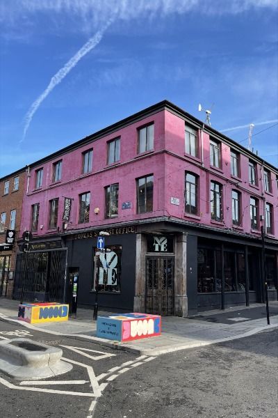 Pink building Northern Quarter Manchester, Trendy Bars, Manchester Northern Quarter, Unique Shops, Street At Night, Night Portrait, Trendy Bar, Small Shops, Leather Coat