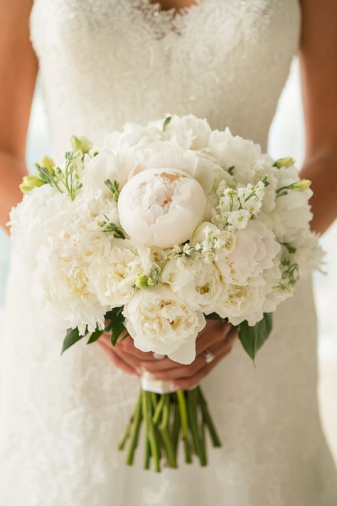 Wow your guests with 35 wedding bouquets with peonies that are designed to impress. These stunning arrangements feature lush blooms and creative designs that will make your big day unforgettable. See the full list! #wowfactor #peonyflorals #weddingflowers Blush Flower Bouquet Wedding, Peonies Bridal Bouquet White, White Neutral Wedding Flowers, Large Peony Bouquet, White Peony Bouquet Wedding Hydrangeas, White Fall Wedding Bouquets, Bridal Bouquet Ideas 2024, Wedding Flowers Peony, Traditional Bridal Bouquet