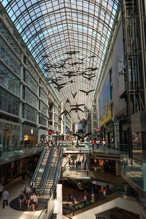 Shopping Mall in Toronto, Canada. Toronto, Canada - September 5, 2015: Inside view of a modern shopping mall (Eaton Centre) in Toronto's city centre, full of stock photos Shopping Mall Photography, Toronto Canada Aesthetic, Toronto Mall, Mall Photography, Fantasyland Hotel, Modern Shopping Mall, Canada Toronto City, Toronto Kensington Market, Toronto View