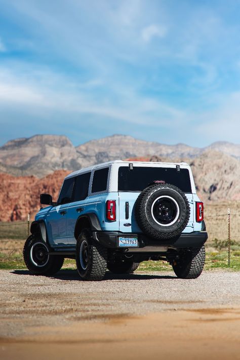 2023 Ford Bronco Heritage Edition in Robins Egg Blue Parked On A Dirt Road During The Day With Red Rock Mountains In The Background. Ford Bronco Aesthetic 2023, Light Blue Bronco, Baby Blue Bronco, Vintage Ford Bronco Aesthetic, Blue Ford Bronco, Azure Grey Bronco, Ford Bronco Beach Aesthetic, Car Manifestation, Ford Bronco Heritage