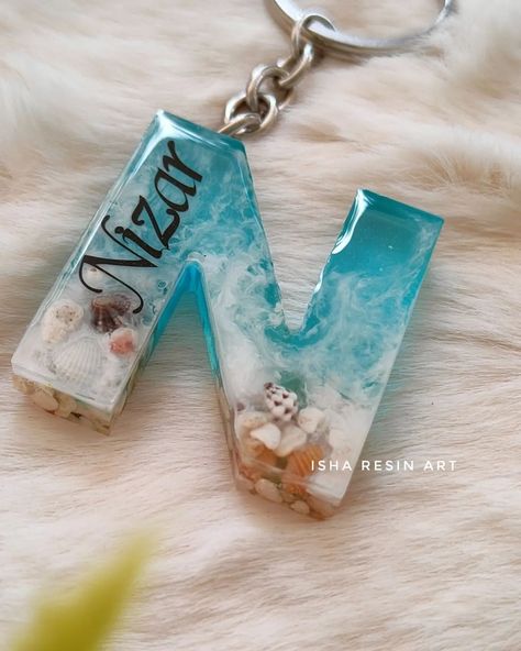 Alphabet name keychain in ocean theme 🩵 #customizedproducts #resin #resinartistsofinstagram #resincreations #keychaincollection #alphabet #namekeychains #handmadekeychains #oceantheme #oceancreatures #letterN#cutethings #customisedwork (Resin, resinart, keychains, namekeychain, customized keychains,letterN) Resin Art Alphabet Keychain, Resin Name Keychain, Alphabet Resin Keychain, Alphabet Keychain, Alphabet Names, Name Keychain, Handmade Keychains, Resin Keychain, Letter N