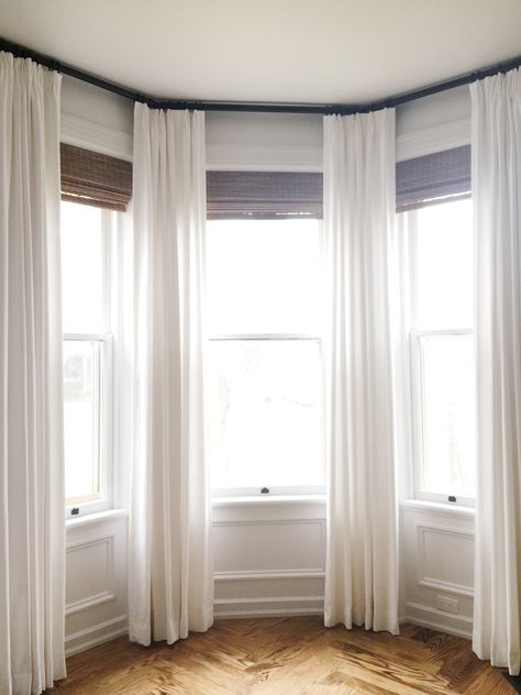 Curtains Around Bay Window, White Curtains Bay Window, Bay Window Sheer Curtain Ideas, Long Curtains Bay Window, Curtains On Stairway Window, Drapes On Bay Window, Bay Curtains Bedroom, Tall Bay Window Ideas, Bedroom Drapes Master Bay Window