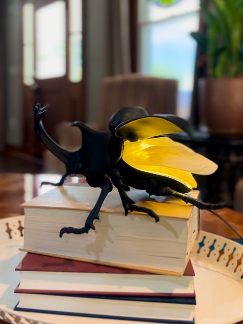 Illuminate your space with this quirky and playful Rhino Beetle Lamp. Made with precision using 3D printing technology, this lamp is a unique addition to any room. Choose from black or champagne gold for the perfect match to your decor. Perfect for bug enthusiasts or anyone looking for a fun and unusual lighting option Insect Home Decor, Bug Themed Bedroom, 3d Printed Aesthetic, Bug Room Decor, Trending Lamps, Eccentric Home Decor, Bug Bedroom, Weird Room Decor, Lighting Ideas Bedroom