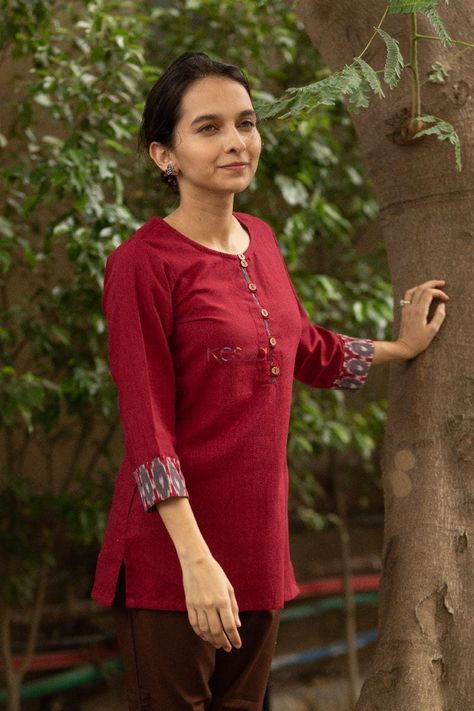 Short Maroon kurti with ikkat patch on the sleeves. Ikkat Tops For Jeans, Cotton Tops For Jeans, Maroon Kurti, Asparagus Garden, Jeans Kurti, Suit Details, Cotton Dress Pattern, Churidar Neck, Pant Top