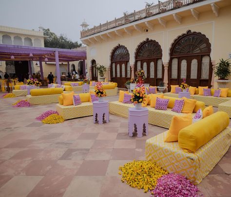 Sharvi and Ishaan’s Haldi decor, a perfect blend of tradition and modern flair at @thealsisarnahargarh 💛💜 Photos- @thewhitebox.in #alsisarmahal #alsisarnahargarh #nahargarhwedding #alsisarmahal #decorbykomal #inspiredesign #weddingdecoration #shaadisaga #decorbykomal #decorationinspo #indianwedding #luxurywedding #grandwedding #goaweddingplanner #goaweddingdecor #weddingdecorator #weddingsofinstagram # #floraldesign #flowerdecoration #weddingdecorideas @fabwedding @weddingz.in @shaadidukaa... Haldi Seating, Haldi Decoration Ideas At Home, Holi Decor, Haldi Decoration Ideas, Goa Wedding, Haldi Decor, Wedding 2025, Haldi Ceremony, Wedding Decor Inspiration