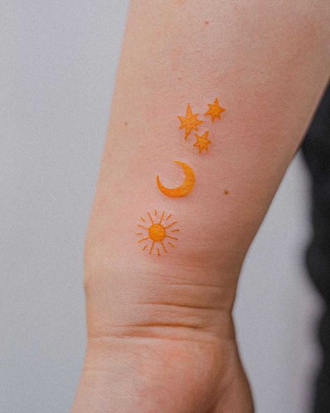 Yellow sun, moon, and stars by tattooist Bongkee inked on the left wrist Yellow Ink Tattoos, Yellow Sun Tattoo, Yellow Tattoo, Small Star Tattoos, Knuckle Tattoos, Tattoo Ideas Easy, Skin Drawing, Sun Tattoos, Cute Tattoo